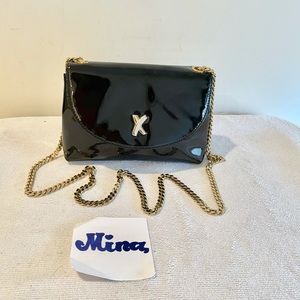 Paloma Picasso black patent leather evening bag.